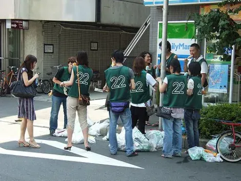 Japanese Volunteers collecting trash